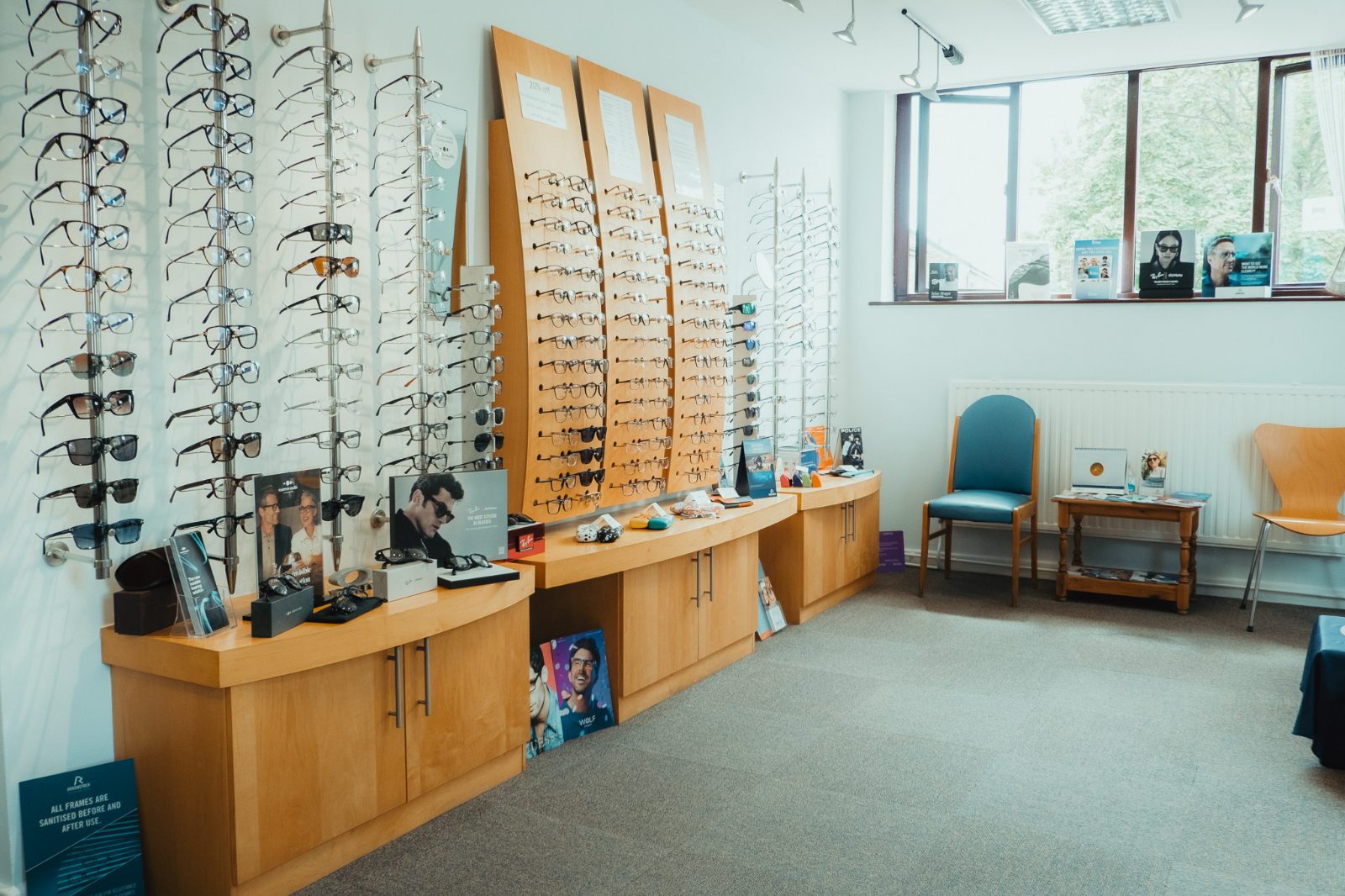 The dispensing area at Murgatroyd Opticians in Conisbrough, with frames displayed along the wall